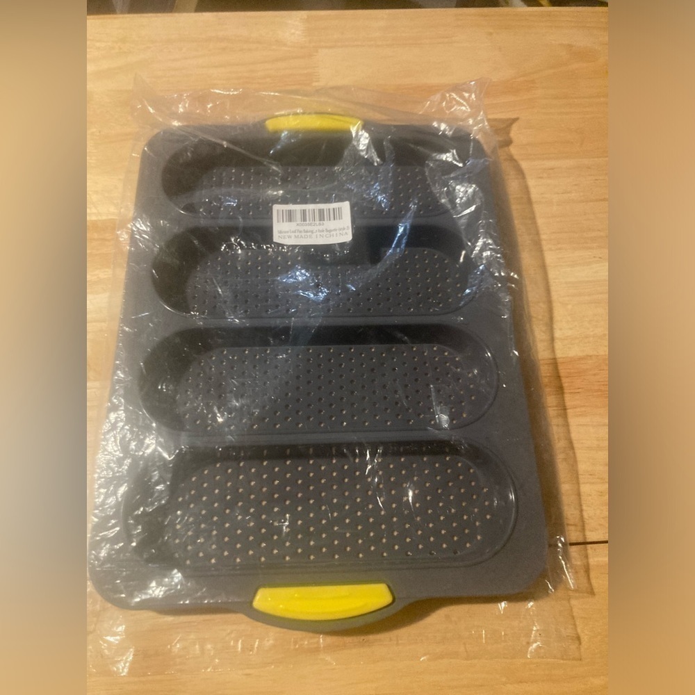 silicone loaf pan. Can make 4 loads at a time. Brand new & never used